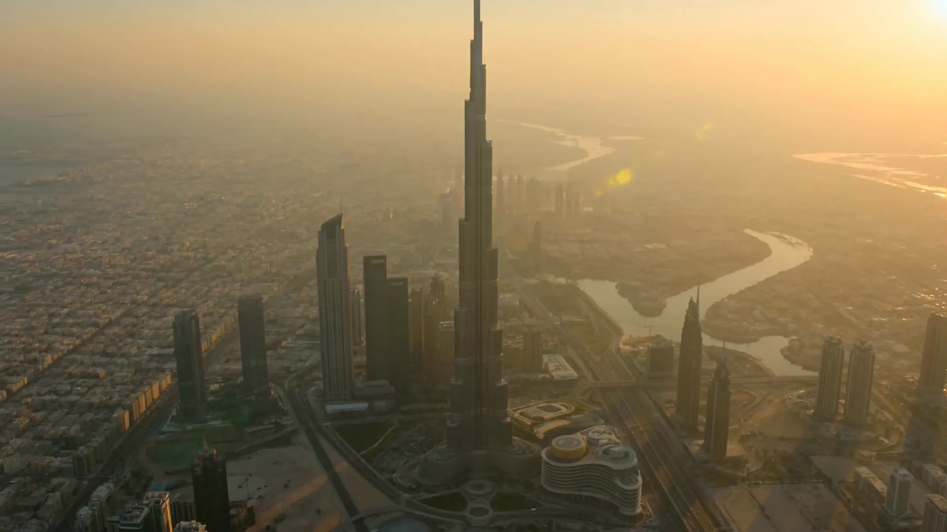 Drone view of the Burj Khalifa and Downtown Dubai at golden hour